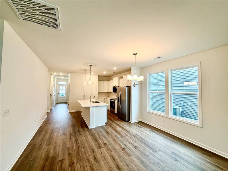 Gleaming wood floors anchor an open layout leading