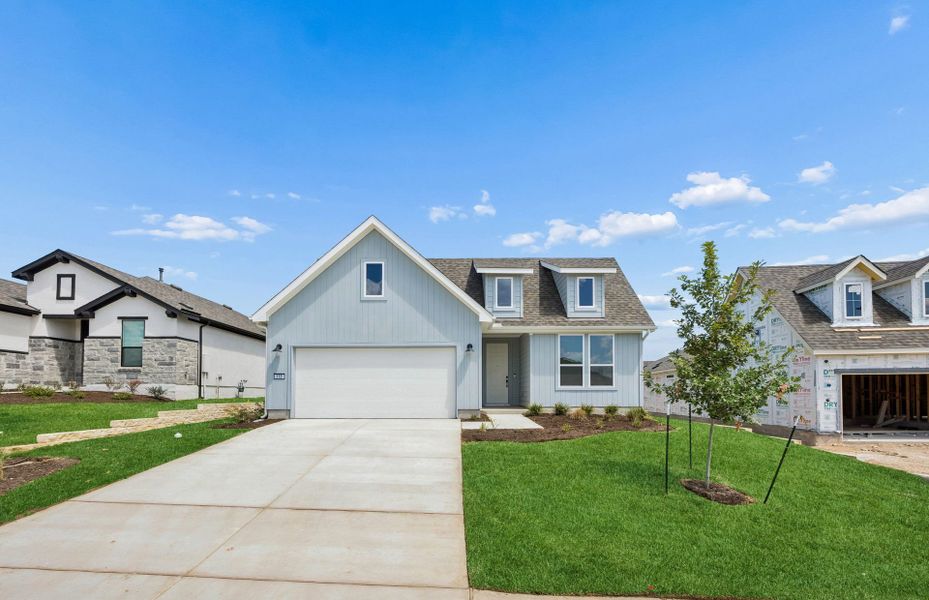Front exterior of a new home in Sun City Texas, Georgetown, TX, highlighting curb appeal (Image 18).