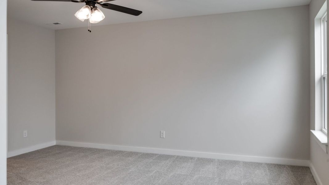 Ceiling fan in primary bedroom
