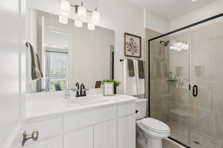 Stylish Secondary Bathroom in American Legend Homes Model Home - Representative Photo of Plan 1462