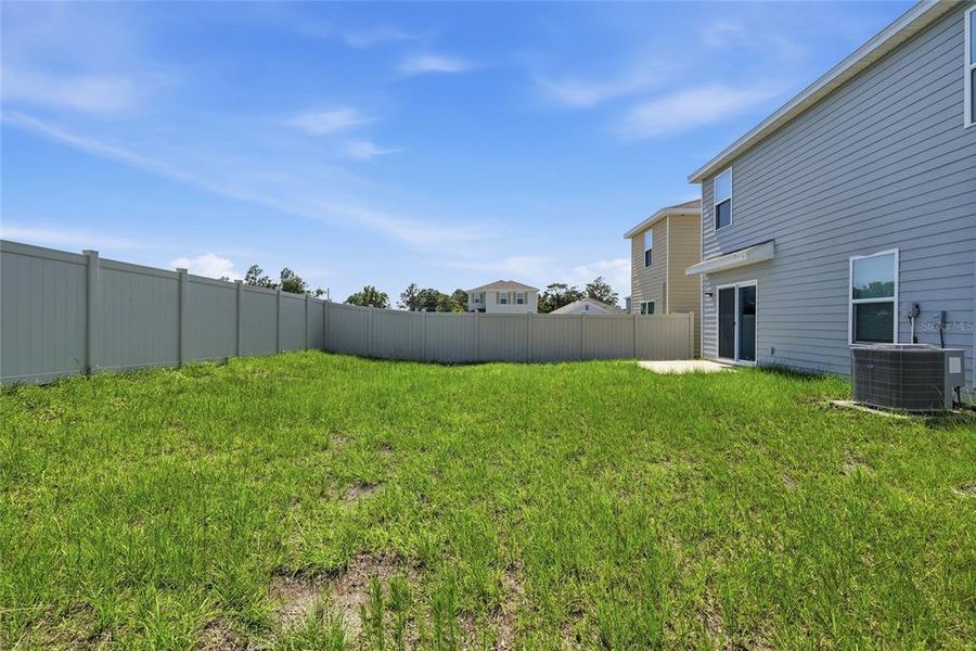 Exterior details and patio area of a home in Avalon Woods, Newberry (Image 26).