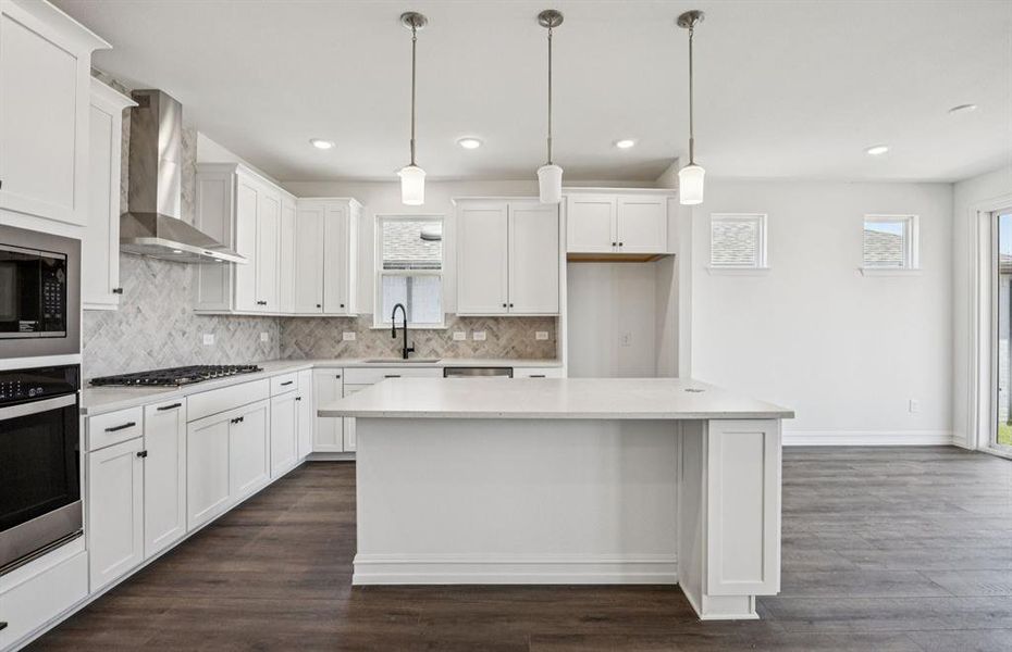 Spacious eat-in kitchen designed with a large island for dining *Real home pictured Spacious eat-in kitchen designed with a large island for dining *Real home pictured