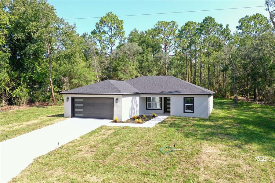 Front exterior of a new home in , Dunnellon, FL, highlighting curb appeal (Image 26).