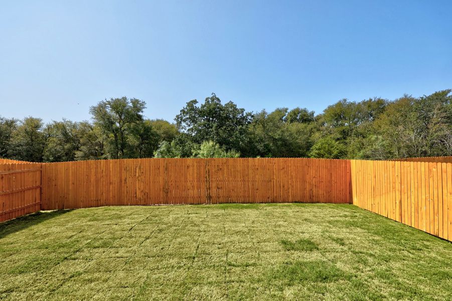 Exterior details and patio area of a home in Trinity Ranch, Elgin (Image 19).