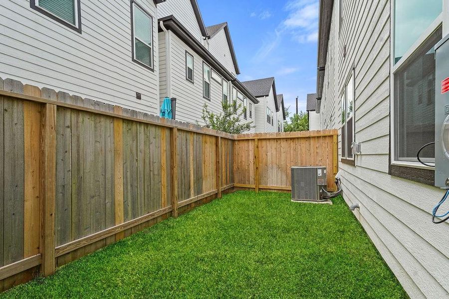 Front exterior of a new home in Highland Commons, Houston, TX, highlighting curb appeal (Image 22).