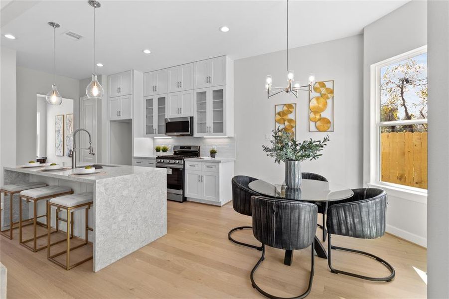 Charming breakfast nook bathed in natural light, offering a cozy space to enjoy your morning coffee or casual meals with family.