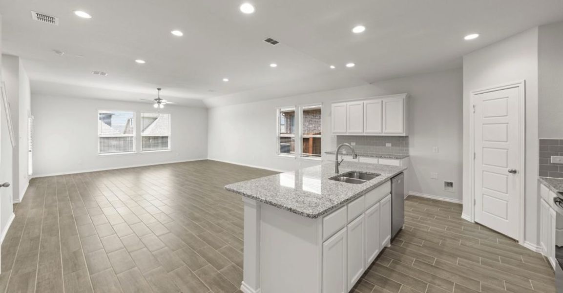 Representative exterior photo of a completed home built from the Raleigh by Impression Homes in Baker Farms, Cleburne, TX (Image 6).