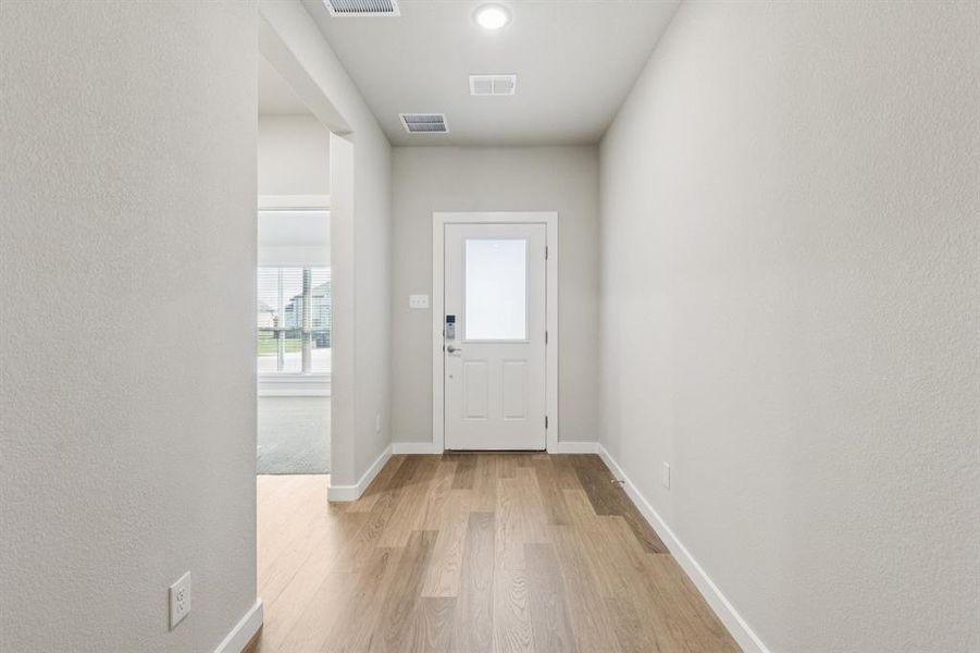 Entryway in the Heisman home plan by Trophy Signature Homes – REPRESENTATIVE PHOTO