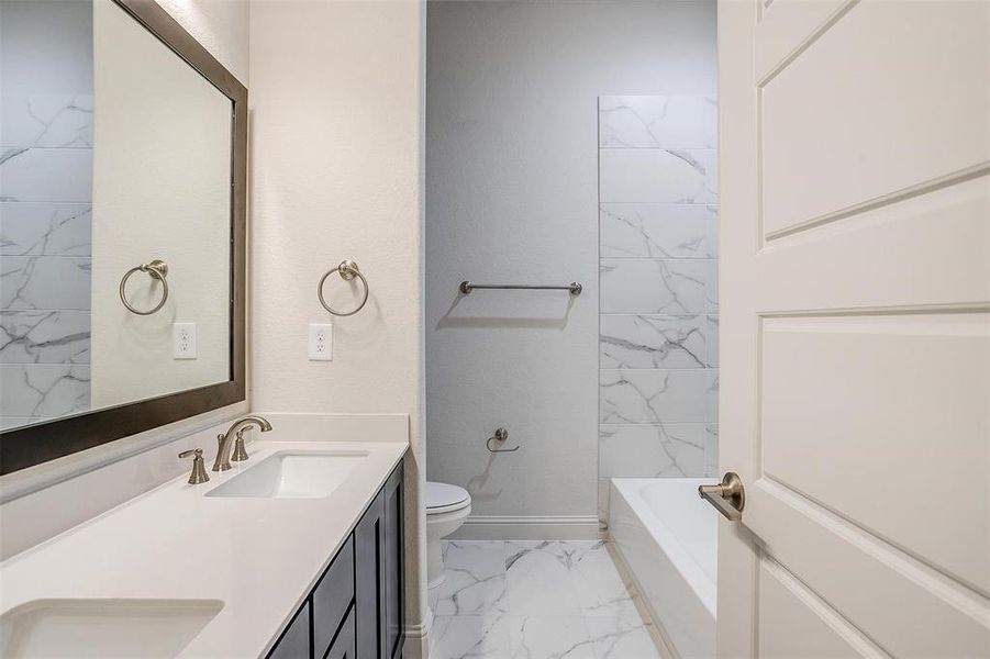 Bathroom with vanity and toilet