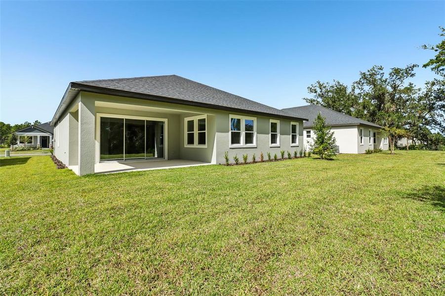 Exterior details and patio area of a home in Ridgehaven - Reserve Series, Ormond Beach (Image 25).