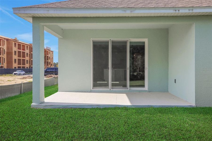 Exterior details and patio area of a home in Crossroads at Kelly Park, Apopka (Image 22).