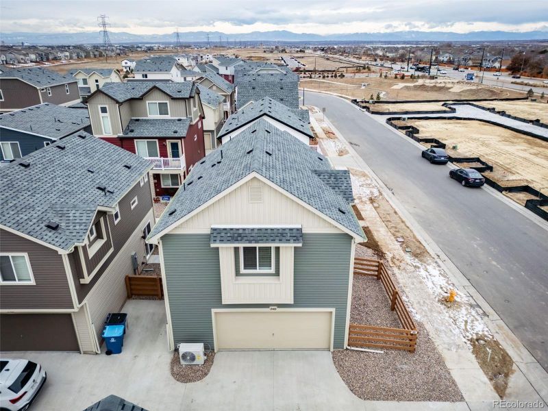 Front exterior of a new home in Muegge Farms, Bennett, CO, highlighting curb appeal (Image 23). Front exterior of a new home in Muegge Farms, Bennett, CO, highlighting curb appeal (Image 23).