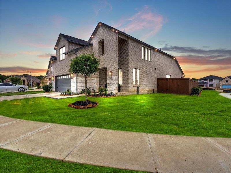 Front exterior of a new home in The Trails, New Caney, TX, highlighting curb appeal (Image 27).
