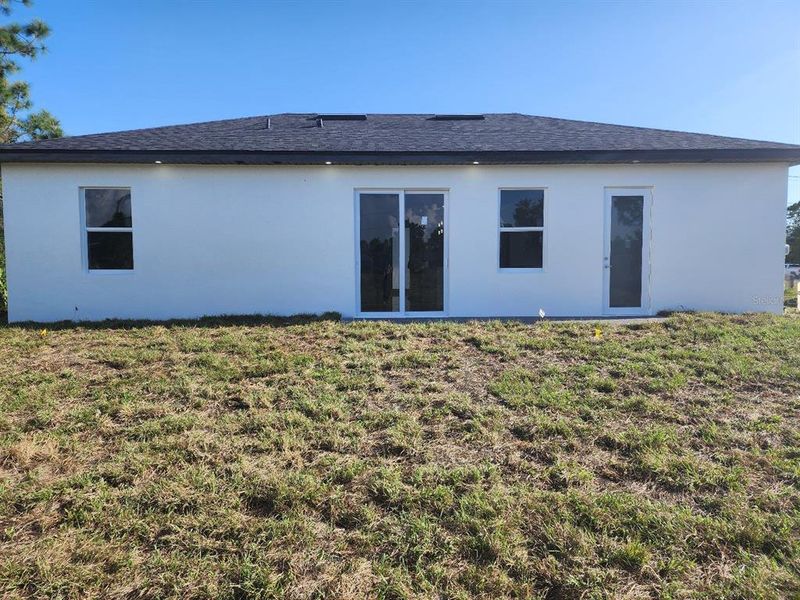 Front exterior of a new home in , Lehigh Acres, FL, highlighting curb appeal (Image 14).