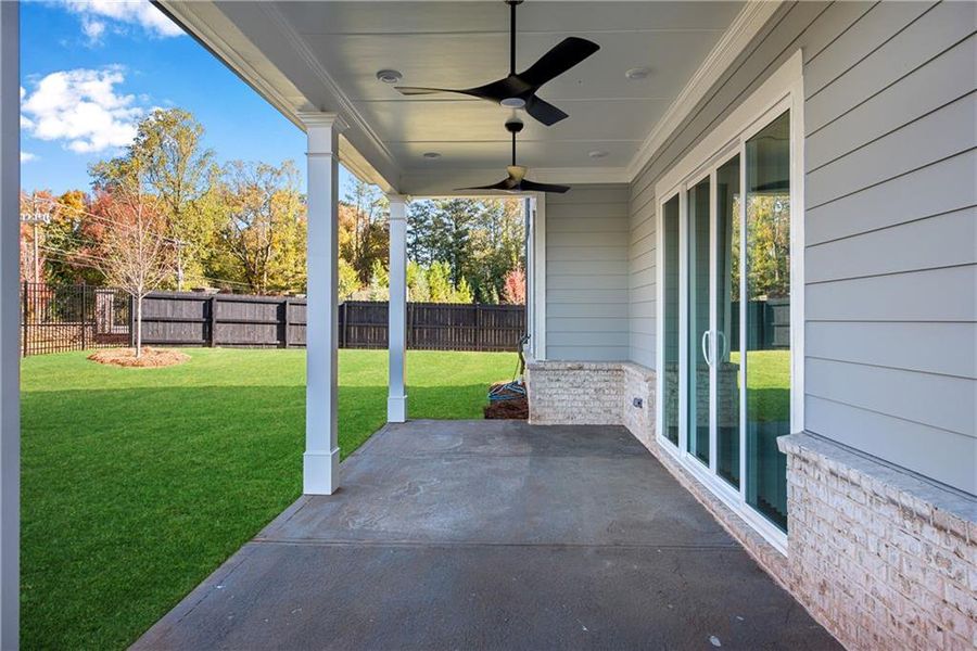 Exterior details and patio area of a home in The Retreat at Caney Creek, Alpharetta (Image 33).