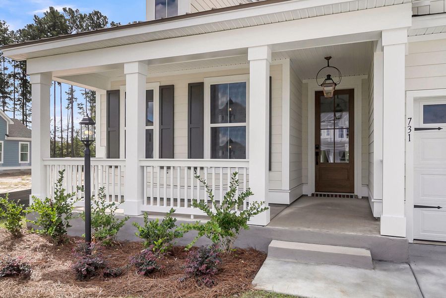 Exterior details and patio area of a home in Tidewater at Lakes of Cane Bay, Summerville (Image 23).