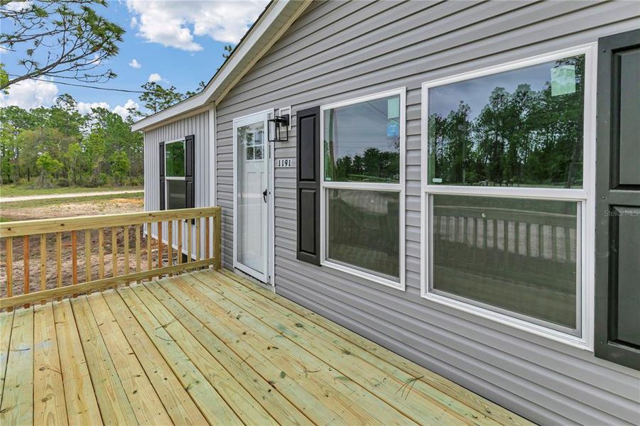 Exterior details and patio area of a home in , Williston (Image 24).