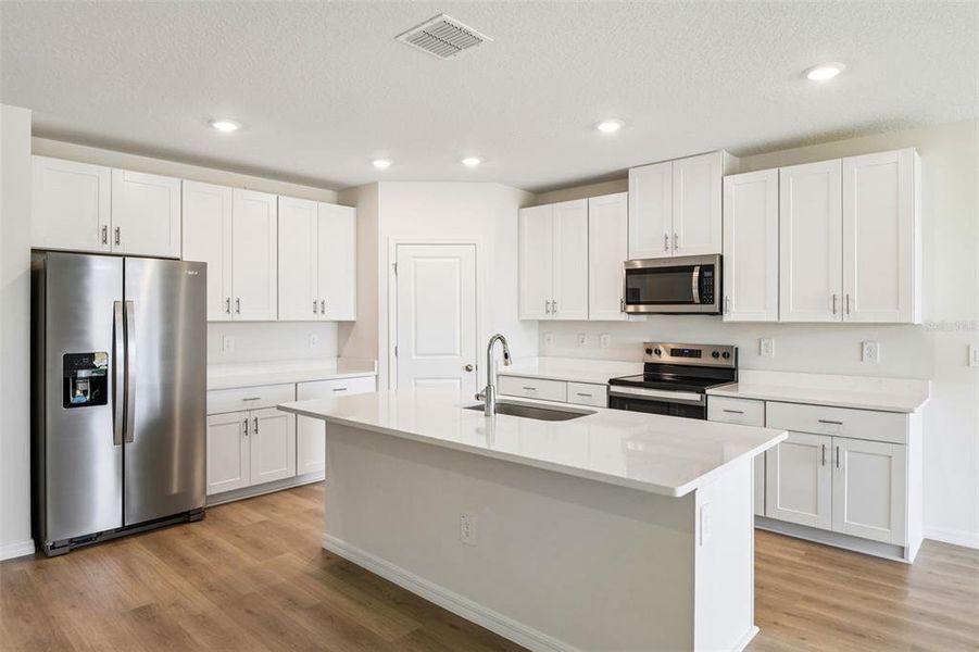 Furnished interior view inside a new home in Two Rivers - Classic Series, Zephyrhills (Image 4).