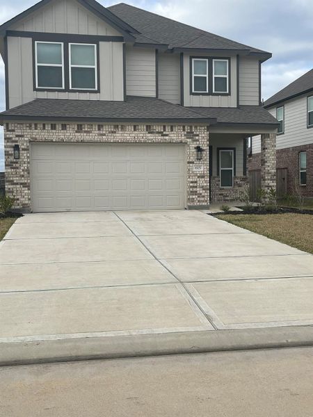 Front exterior of a new home in Huntington Place, Rosharon, TX, highlighting curb appeal (Image 17).