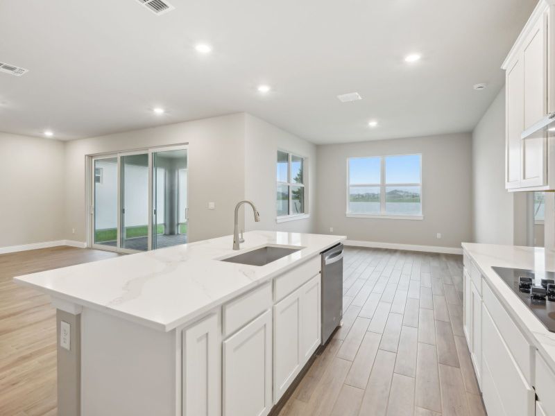 Kitchen in the Coral floorplan at 6398 NW Sweetwood Dr