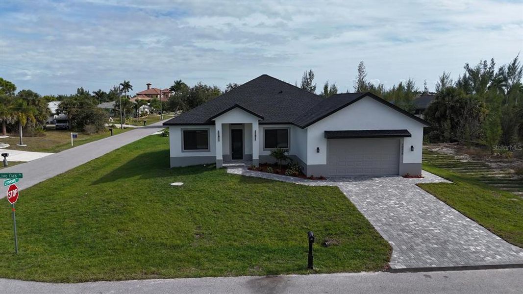 Front exterior of a new home in , Port Charlotte, FL, highlighting curb appeal (Image 1). Front exterior of a new home in , Port Charlotte, FL, highlighting curb appeal (Image 1).