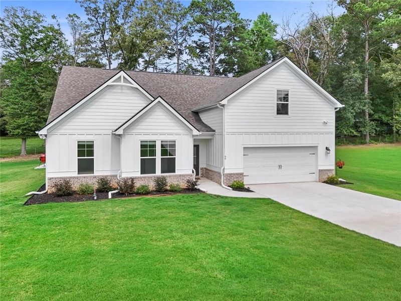 Front exterior of a new home in , Moreland, GA, highlighting curb appeal (Image 2). Front exterior of a new home in , Moreland, GA, highlighting curb appeal (Image 2).