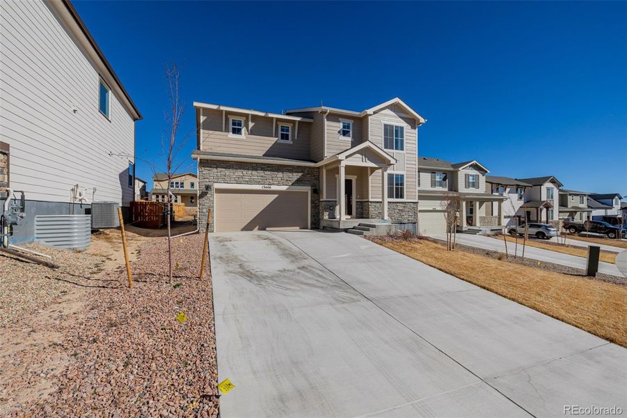 Front exterior of a new home in , Peyton, CO, highlighting curb appeal (Image 23).