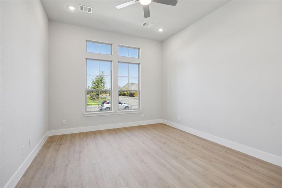 Unfurnished room featuring light wood-style floors and recessed lighting