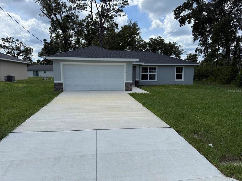 Front exterior of a new home in , Dunnellon, FL, highlighting curb appeal (Image 1). Front exterior of a new home in , Dunnellon, FL, highlighting curb appeal (Image 1).