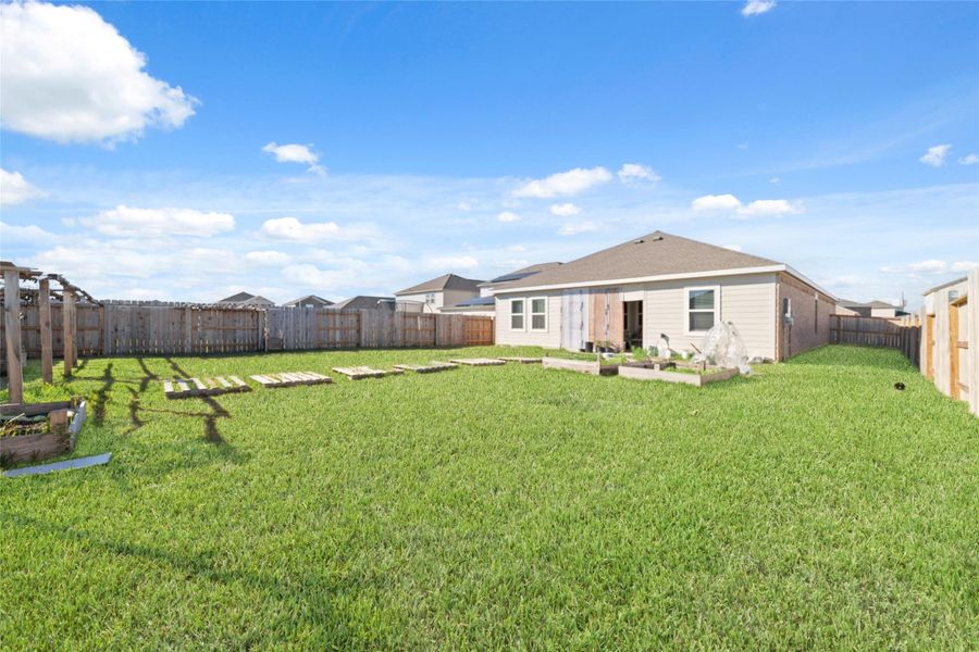 Exterior details and patio area of a home in Sunterra, Katy (Image 3).