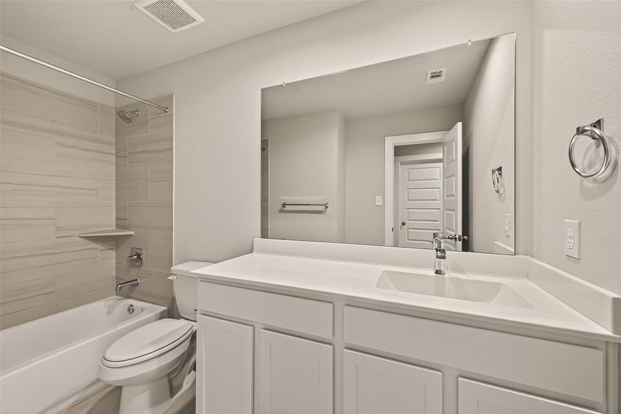 The second-floor common bathroom includes a tub and shower combination along with a sink for daily use.