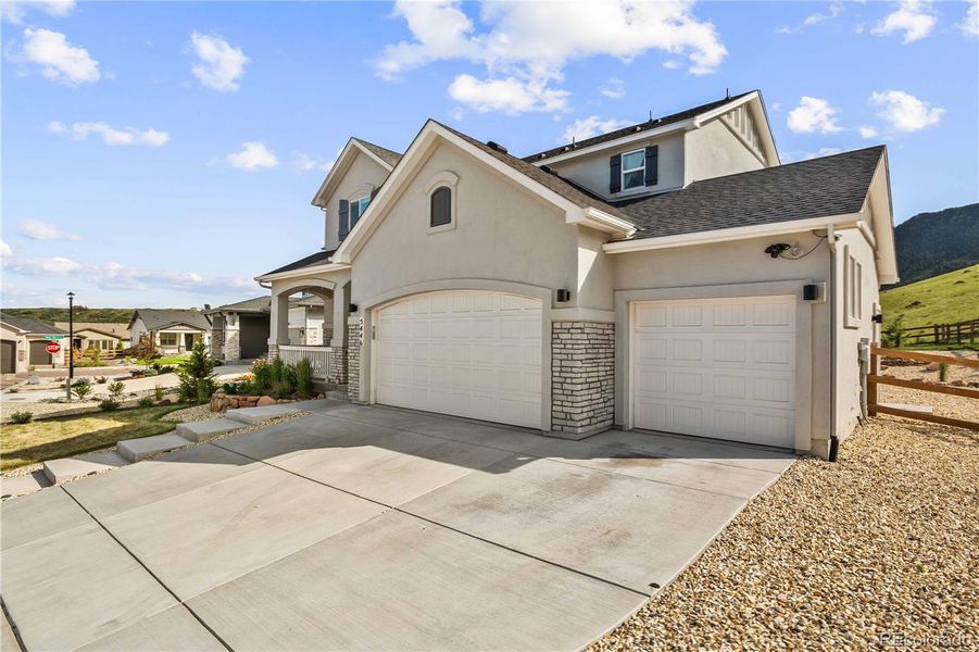 Front exterior of a new home in , Monument, CO, highlighting curb appeal (Image 21).