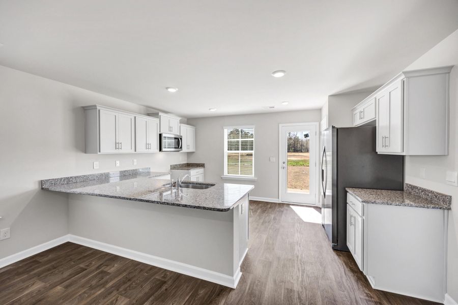 Furnished interior view inside a new home in The Park at Wilkinson, Orangeburg (Image 8). Furnished interior view inside a new home in The Park at Wilkinson, Orangeburg (Image 8).