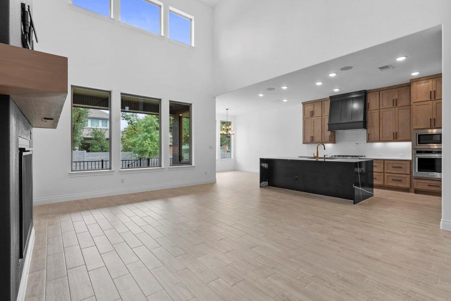 Open-concept living room flowing into the gourmet kitchen, perfect for entertaining and everyday living.