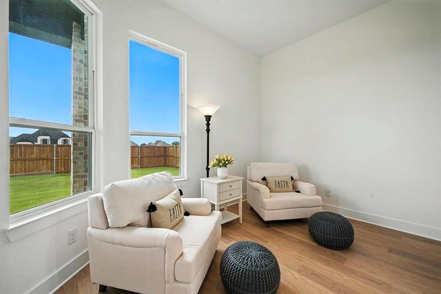 Sitting room with wood finished floors