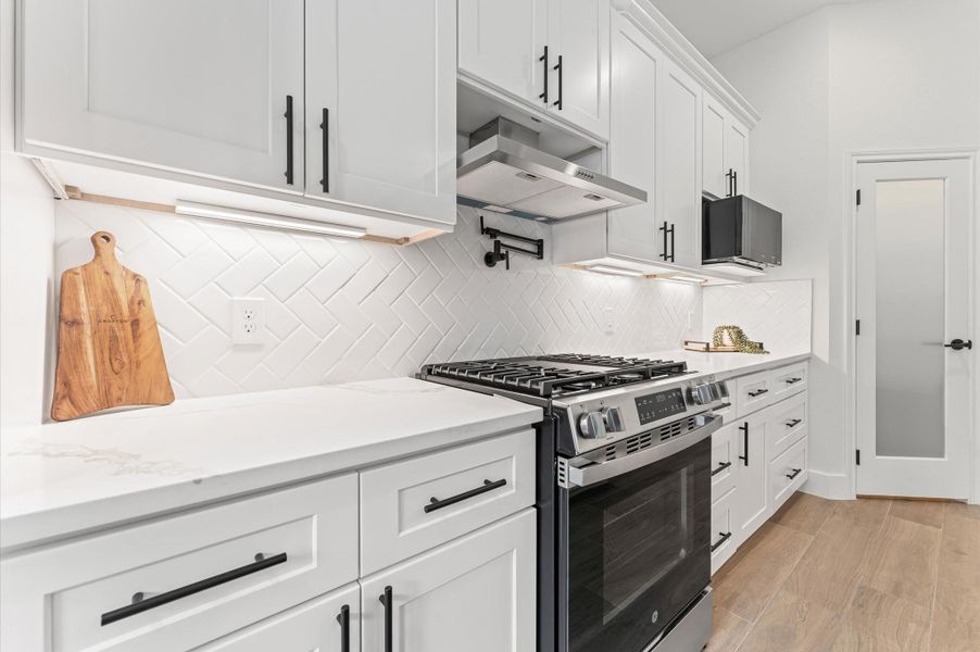 Close-up of the high-end finishes — quartz countertops, custom cabinetry, and sleek fixtures — combining beauty with everyday functionality. Close-up of the high-end finishes — quartz countertops, custom cabinetry, and sleek fixtures — combining beauty with everyday functionality.