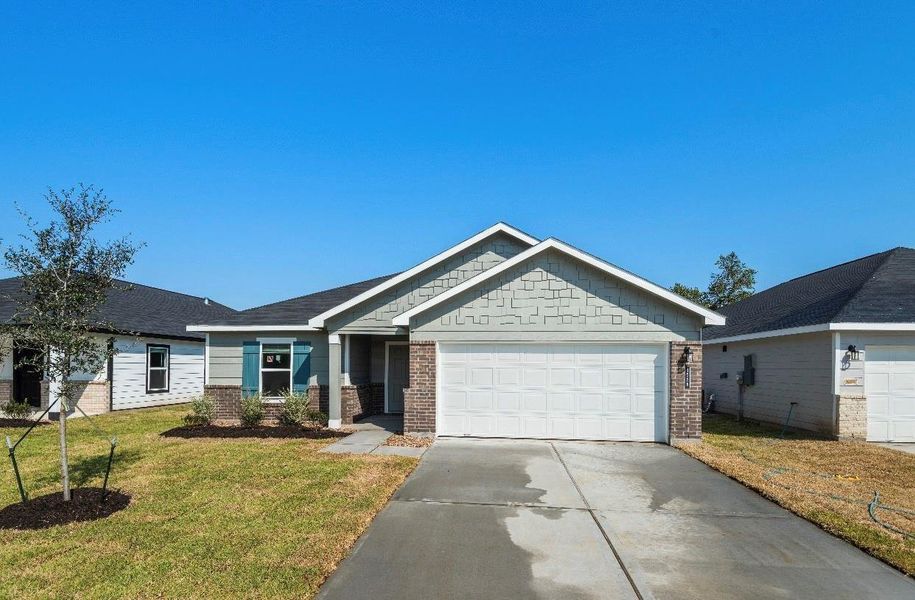 Front exterior of a new home in , Dayton, TX, highlighting curb appeal (Image 1). Front exterior of a new home in , Dayton, TX, highlighting curb appeal (Image 1).