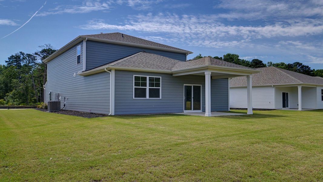 Front exterior of a new home in Sease's Pond, Gilbert, SC, highlighting curb appeal (Image 20). Front exterior of a new home in Sease's Pond, Gilbert, SC, highlighting curb appeal (Image 20).