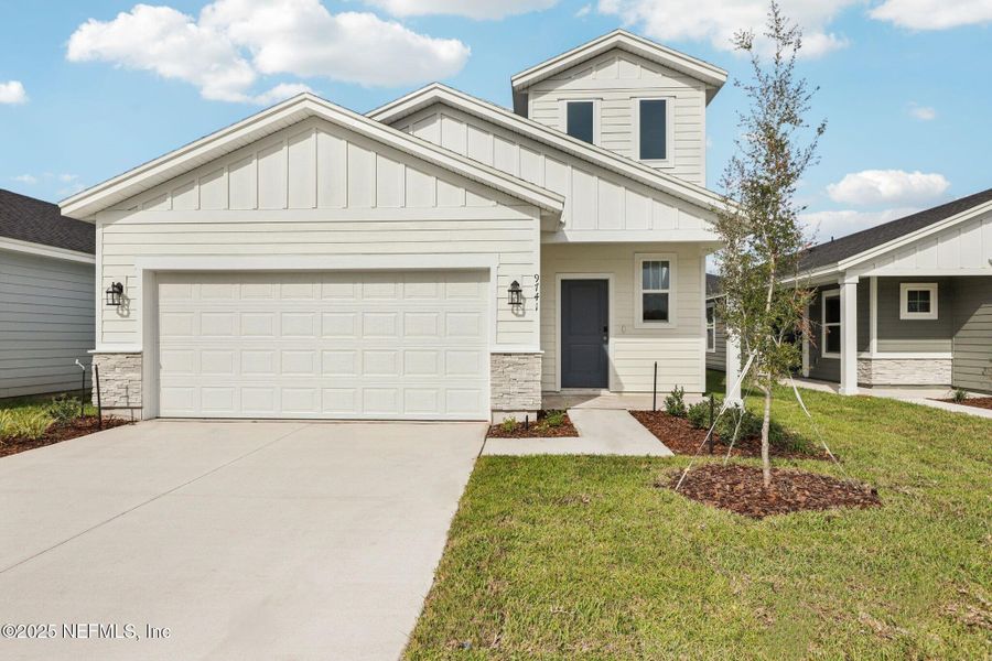 Front exterior of a new home in Cypress Meadows - Classic Series, Jacksonville, FL, highlighting curb appeal (Image 2).
