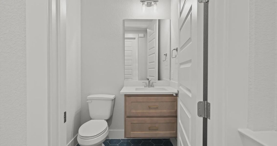 Representative furnished interior of a home built from the Bradley by Chesmar Homes in Sweetwater, Austin (Image 16).