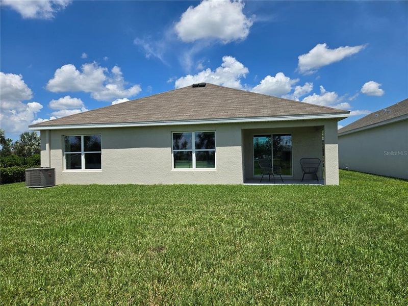 Front exterior of a new home in Rye Crossing, Parrish, FL, highlighting curb appeal (Image 19).