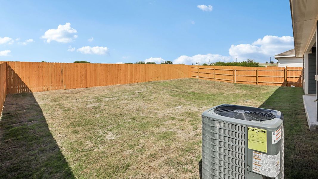 Exterior details and patio area of a home in Prairie Lakes, Buda (Image 27).