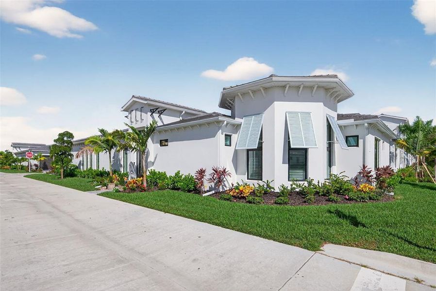 Exterior details and patio area of a home in Aqua Single Family Homes, Bradenton (Image 3).