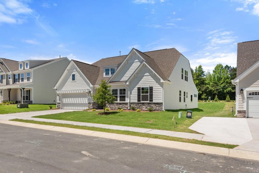 Front exterior of a new home in Wexford, Elon, NC, highlighting curb appeal (Image 28).