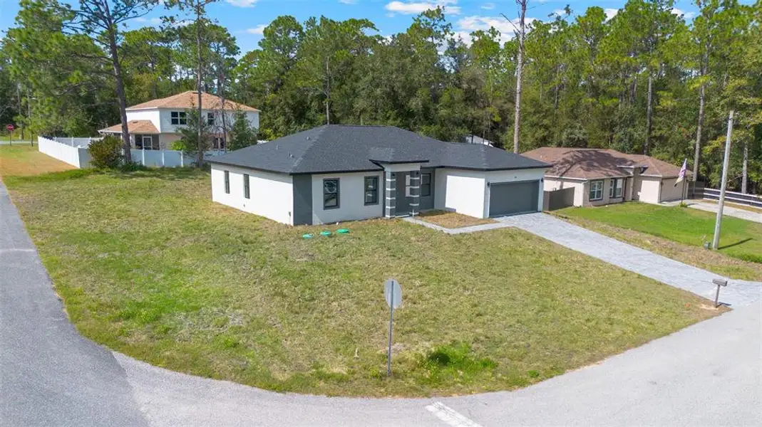 Front exterior of a new home in , Citrus Springs, FL, highlighting curb appeal (Image 1). Front exterior of a new home in , Citrus Springs, FL, highlighting curb appeal (Image 1).