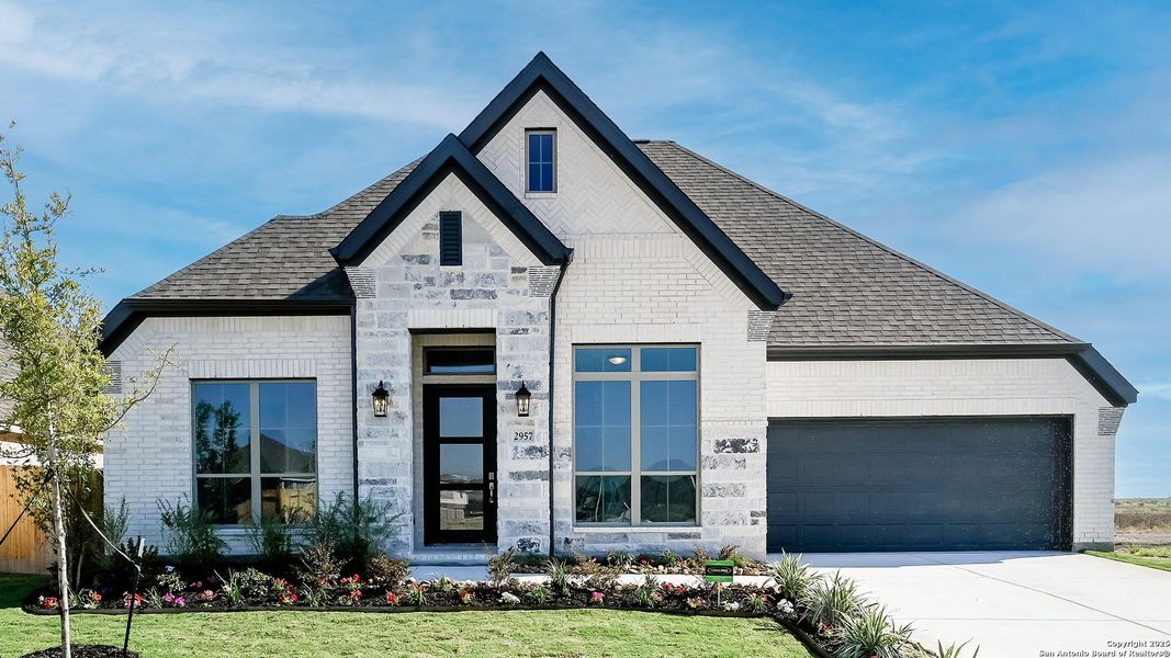 Front exterior of a new home in Meadows Of Mill Creek 60', Seguin, TX, highlighting curb appeal (Image 20).