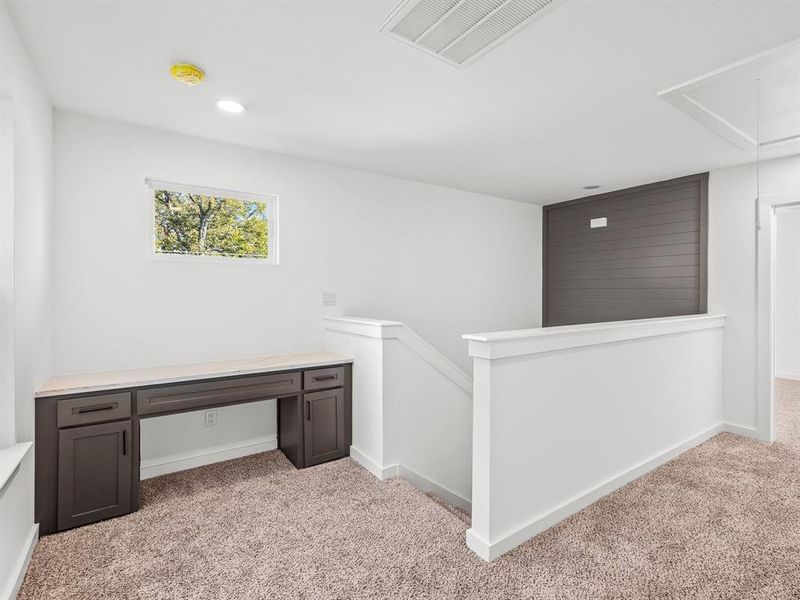 Unfurnished office featuring attic access, light carpet, and recessed lighting