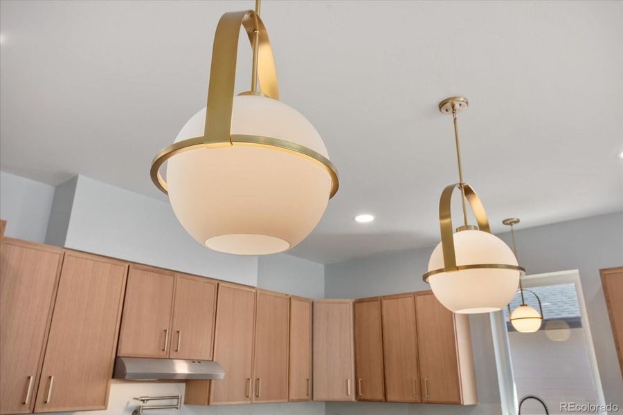 Beautiful gold-toned bronze accents throughout