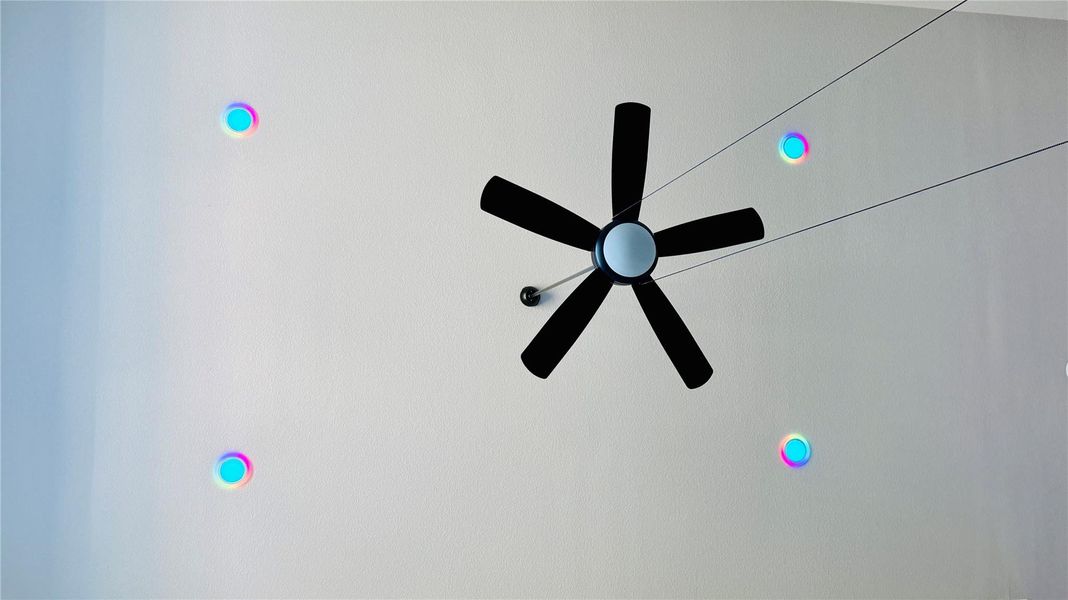 Integrated lighting and a modern ceiling fan offer comfort and illumination for any room.