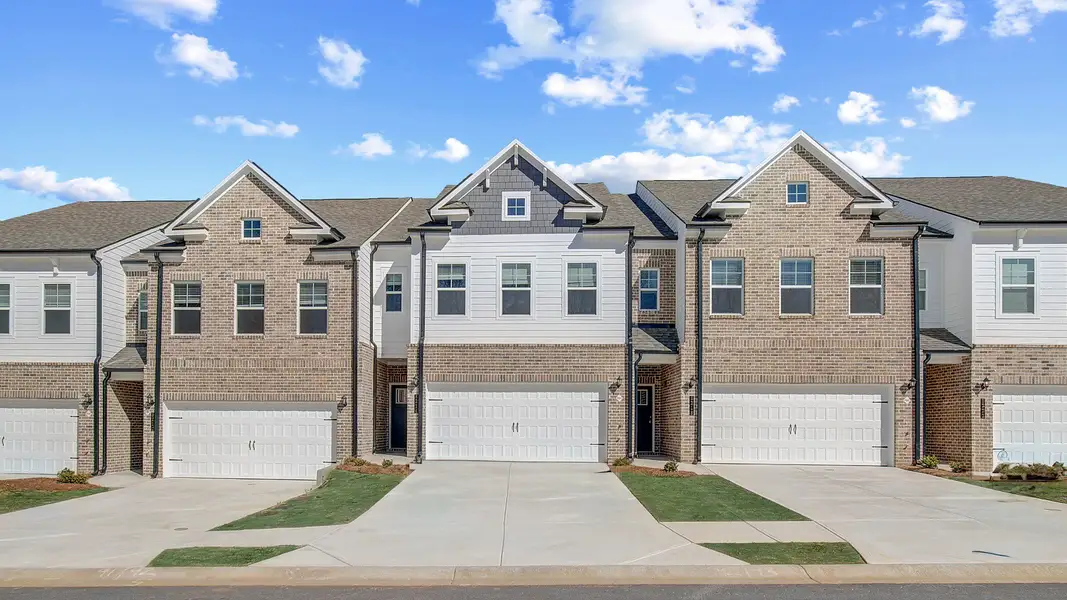 Front exterior of a new home in Auburn Ridge, Riverdale, GA, highlighting curb appeal (Image 1). Front exterior of a new home in Auburn Ridge, Riverdale, GA, highlighting curb appeal (Image 1).
